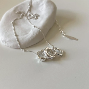 Elegant 925 sterling silver necklace with interlocking triple rings and zircon pendant