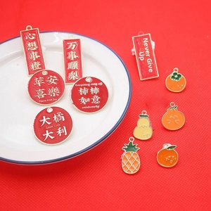 Detailed enamel fruit charms with good luck inscriptions in a festive arrangement