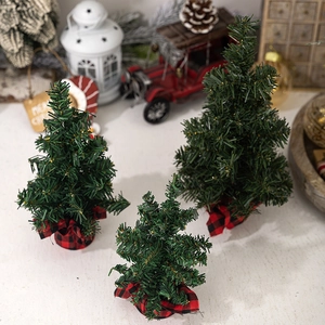 Miniature pine Christmas trees with red and black plaid burlap bases in three sizes