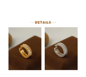 Detailed close-up of luxury gold and silver open rings with emerald-cut zircon stones