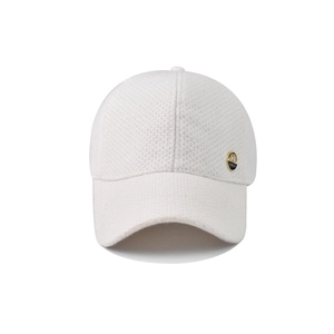 White knit baseball cap featuring a premium textured finish and side gold metal emblem