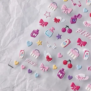 3D embossed nail stickers featuring pink bows, hearts, and fashion icons on backing paper
