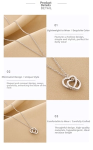 Detail of interlocking S925 silver double heart pendant with pavé crystals and fine chain