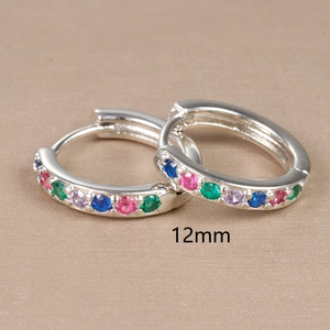 Macro shot of 12mm silver hoop earrings with multicolored cubic zirconia stones