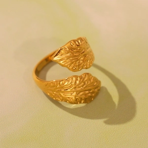 Polished golden leaf textured open ring with intricate 3D veins and adjustable band design