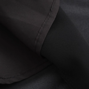 Elegant black French V-neck dress with lace stitching and a high-quality chiffon fabric texture