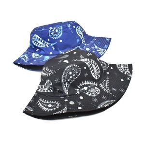 Reversible paisley bucket hat for women in navy and black with wide brim sun protection