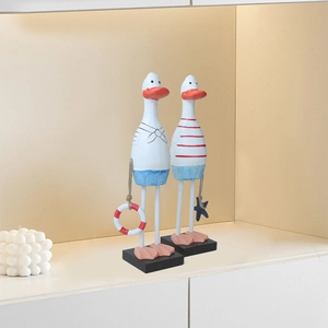 Mediterranean nautical wooden duck figurines with sailor outfits on black pedestals