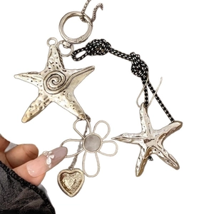 Starfish and heart pendant necklace with vintage metallic finish and woven rope cord