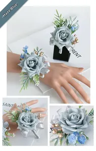 Detail of misty blue rose wrist corsage and boutonniere set with silk ribbons