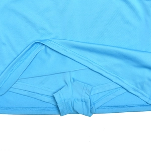Detail view of light blue athletic skort showing the built-in safety shorts and elastic fabric