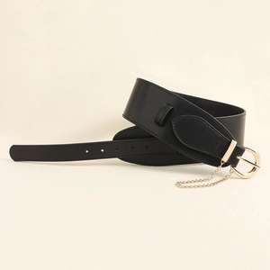Detail of wide black leather belt with large gold D-ring buckle and decorative metal chain