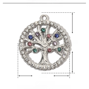 Macro detail of Tree of Life pendant in stainless steel with multi-color rhinestones