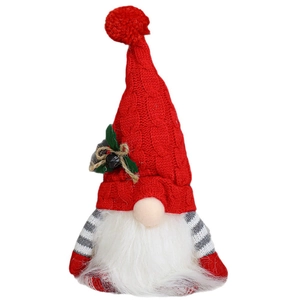 Christmas gnome doll with red knitted hat and white beard on white background