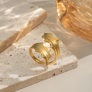 Elegant gold swirling leaf open ring with a polished finish and adjustable nature-inspired design