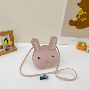 Detailed close-up of pink rabbit cartoon kid crossbody bag with leather texture