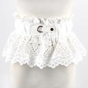 Close-up of white lace corset belt featuring floral hollow patterns and metal buckle detail