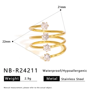 Detail of 18K gold plated spiral stainless steel ring with four clear zircons