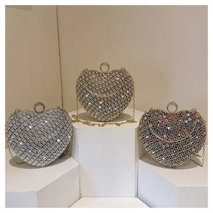 Sparkling rhinestone heart evening bags in silver, gold, and multi-color on display