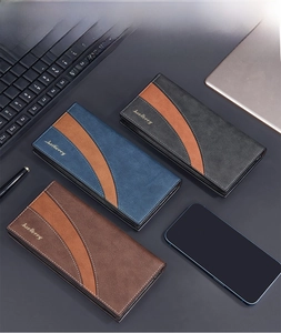 Close-up of three long PU leather men's business wallets in black blue and brown colors