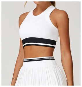 Close-up of seamless yoga vest showing striped elastic hem and pleated skirt texture