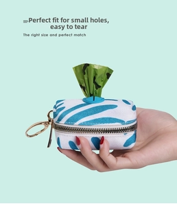 Portable pet waste bag holder in blue striped canvas with silicone dispenser and metal hook