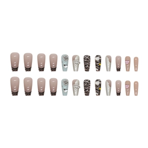 Silver zebra print press-on nails with 3D flower, heart rhinestones and pearl charms