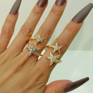 Close-up of adjustable double starfish rings with colorful and white zircon inlay