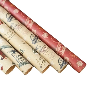 Set of multiple Christmas kraft paper rolls with festive Santa and snowflake patterns
