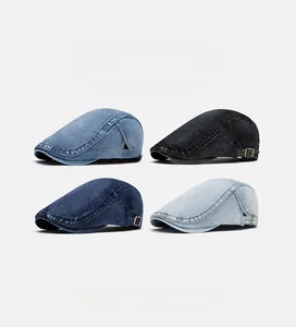 Detail view of washed denim flat caps in four colors with vintage metal adjustment buckles