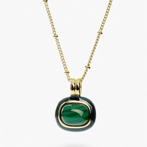 18k gold plated necklace featuring a natural green malachite pendant with black enamel trim