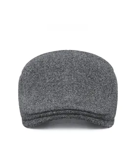 Front view of charcoal grey wool newsboy cap showing textured herringbone fabric and brim