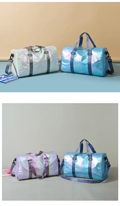 Close-up of gradient travel bags in silver and blue with waterproof fabric and side straps