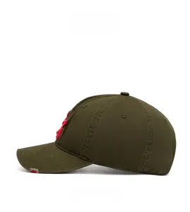 Side view of olive green cotton baseball cap with red embroidery and distressed details