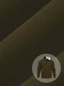 Macro shot of army green waffle knit fabric and standing collar half-zip sweatshirt detail