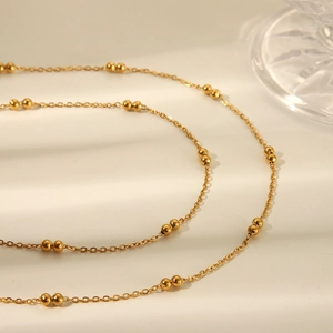Minimalist multi-layer stainless steel gold waist chain with delicate bead accents