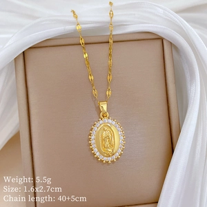Detailed macro view of gold religious pendant with zircons on white silk background