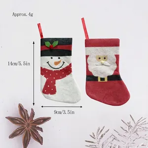 Mini Christmas stocking cutlery holders set with Santa and snowman patterns