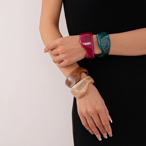 Vintage irregular resin bangles set with wavy geometric design in multiple colors