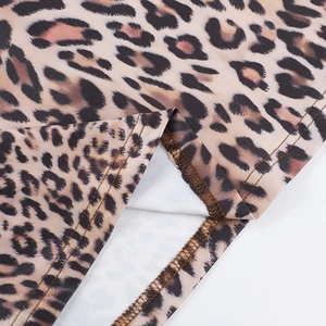 Close-up of double-needle stitching and leopard print texture on bikini swimwear hem