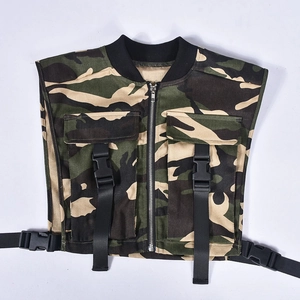 Detail of camouflage tactical vest featuring functional buckles and utility chest pockets