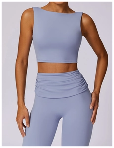 Detail of lavender yoga top and high-waist leggings with unique gathered waist design