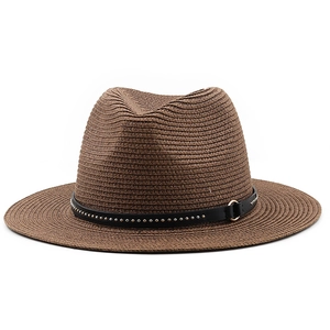 Detailed texture of dark brown fedora straw hat with black rivet decorative band
