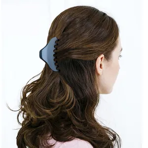 Chic matte dark grey shark hair claw clip shown on a half-up hairstyle