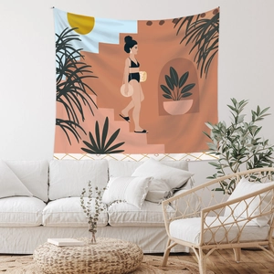 Detail of bohemian tapestry featuring tropical illustration on white wall above a sofa