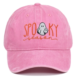 Close-up of spooky season ghost embroidery on a washed rose pink vintage cotton baseball cap