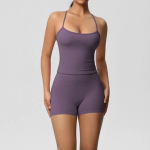 Detail of purple two-piece yoga set with slim fit sports bra and high-waisted shorts