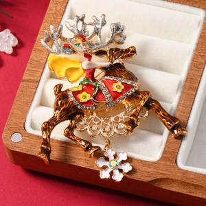 Christmas reindeer brooch with red enamel character and sparkling snowflake pendant