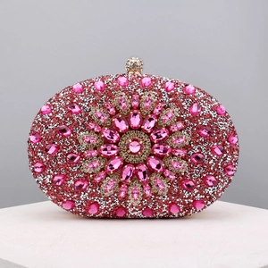 Close-up of luxury oval evening bag with pink and silver crystals in floral pattern