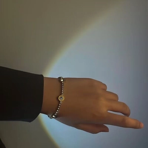 Elegant stainless steel roman numeral bracelet with micro-pave crystals on female wrist